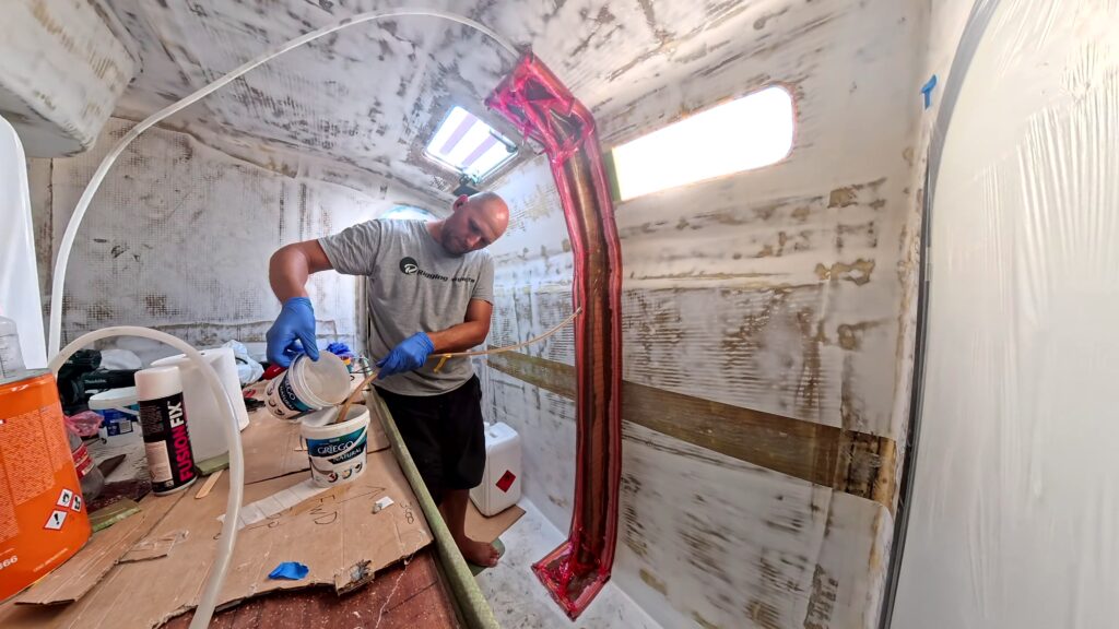 Shayne infusing the structural box beam in stbd aft cabin