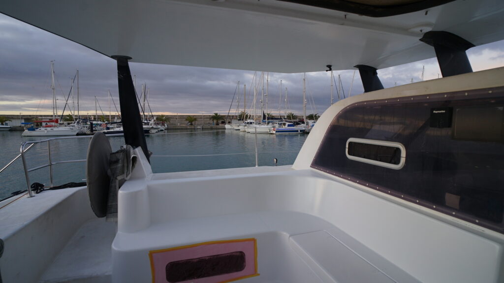 cockpit showing roof made from carbon spreaders and americas cup yacht deck panels